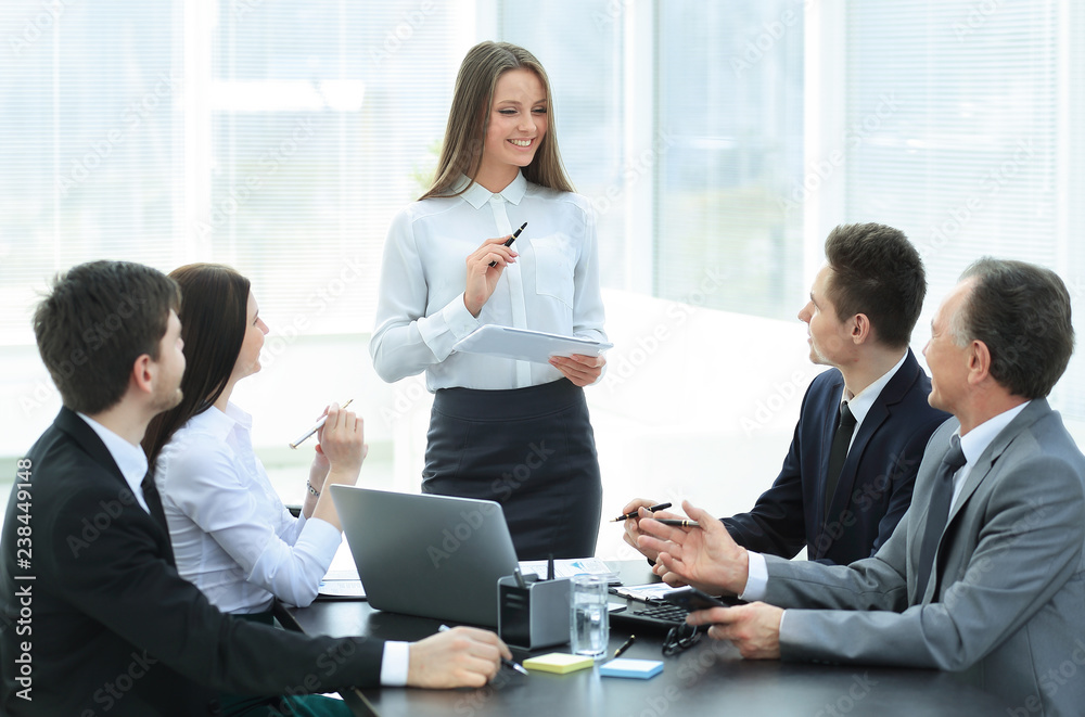 young business woman makes a report on the working meeting young business woman makes a report on the working meeting