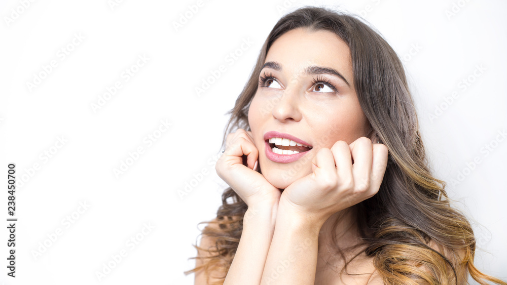 Closeup portrait beautiful smiling woman with white healthy teeth, clean skin. Female dreams, thinks of the idea on a white isolated background. Copy space. Closeup portrait beautiful smiling woman with white healthy teeth, clean skin. Female dreams, thinks of the idea on a white isolated background. Copy space.