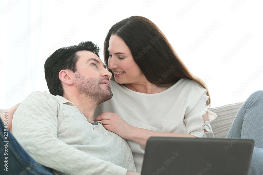 man with his girlfriend chatting on laptop at home indoor man with his girlfriend chatting on laptop at home indoor
