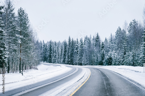 Car in a road at snowy winter Lapland