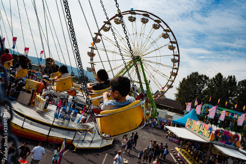 Young boy on an merry go round ride