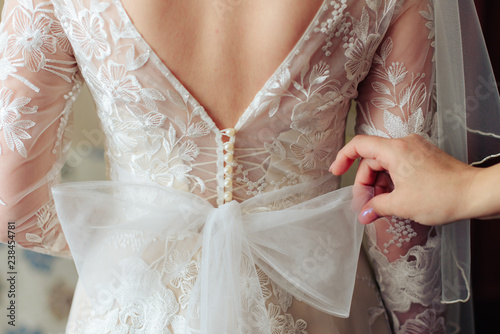 morning of the bride, a beautiful woman in a white dress is preparing for the wedding