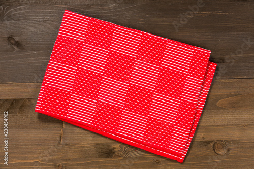 Red checkered cloth on a wooden surface