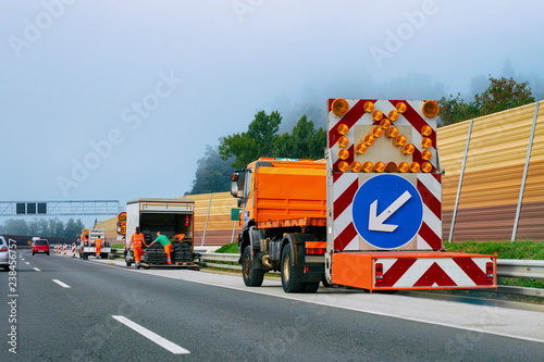 Photography Truck carry arrow down left reflective direction road sign