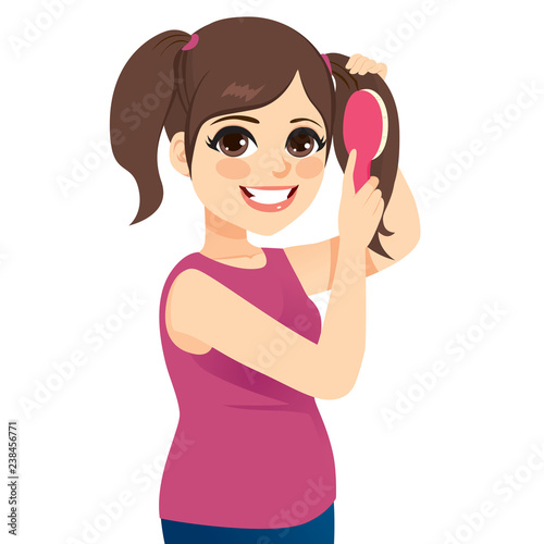 Beautiful young teenager girl combing hair and making pigtails