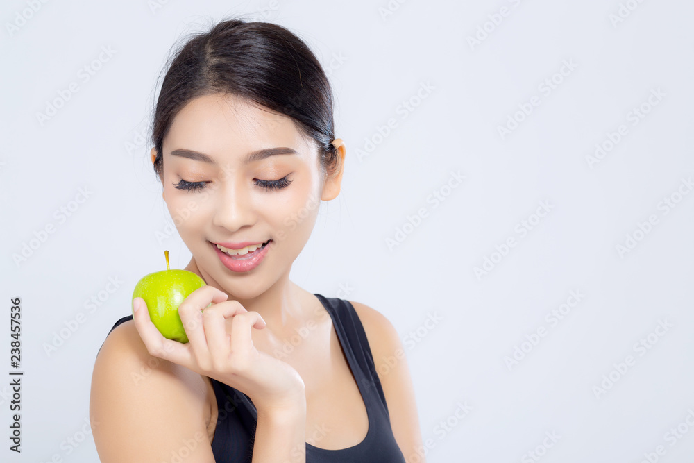 Portrait asian woman smiling holding green apple fruit and beautiful body diet with fit isolated on white background, girl weight slim with cellulite or calories, health and wellness concept. Portrait asian woman smiling holding green apple fruit and beautiful body diet with fit isolated on white background, girl weight slim with cellulite or calories, health and wellness concept.