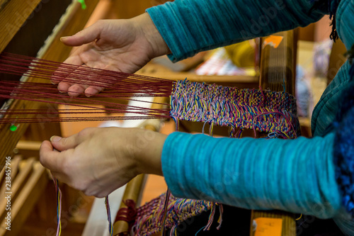 Woman Working in a Weaving Loom, In a Workshop