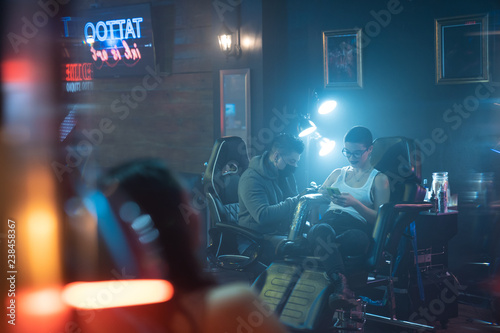 Beauty Parlor With Customers And Tattoo Studio With Clients