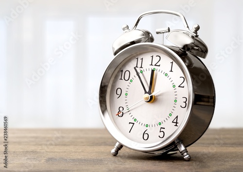 Retro alarm clock on background