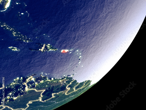 Fototapeta Naklejka Na Ścianę i Meble -  Puerto Rico from space on model of Earth at night. Very fine detail of the plastic planet surface and visible bright city lights.