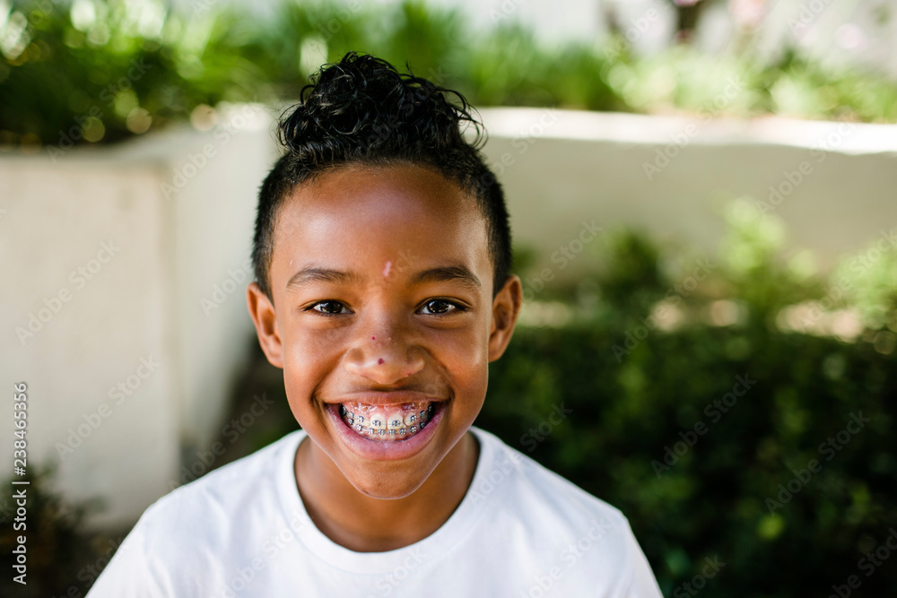 Close-up portrait of cheerful boy standing at park Close-up portrait of cheerful boy standing at park
