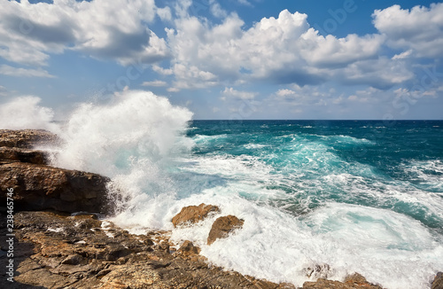 Waves beat on the rocky shore, Mediterranean Sea. photo