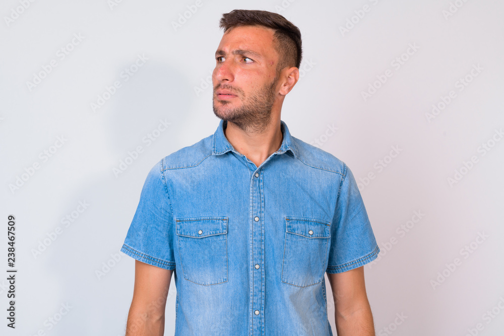 Fototapeta premium Handsome bearded Persian man thinking against white background