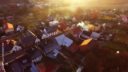 Camera flight over a Czech village in winter. Local heating is important source of emissions. Air pollution and climate change theme. Sustainable development and ecology in European Union.