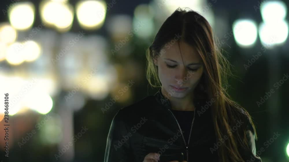Cute young woman typing a mesagge via mobile phone. Cute young woman typing a mesagge via mobile phone.