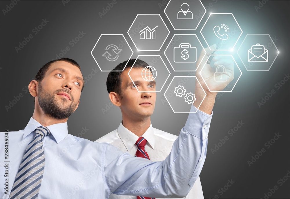 Two Businessmen working together on background Two Businessmen working together on background