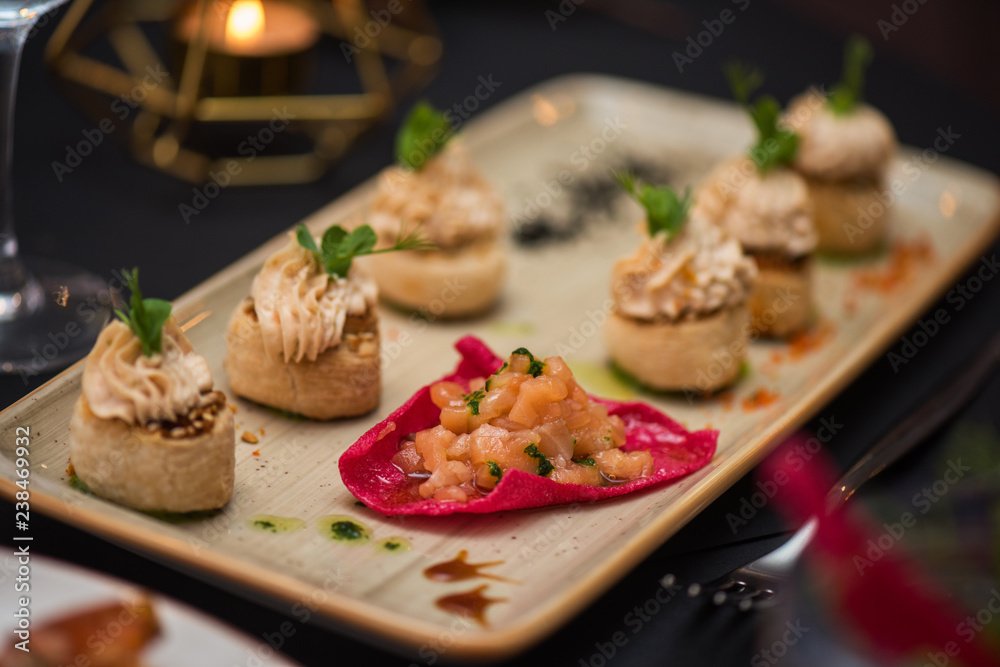 Kegs with salmon fish and cream sauce. Tasty restaurant dish
