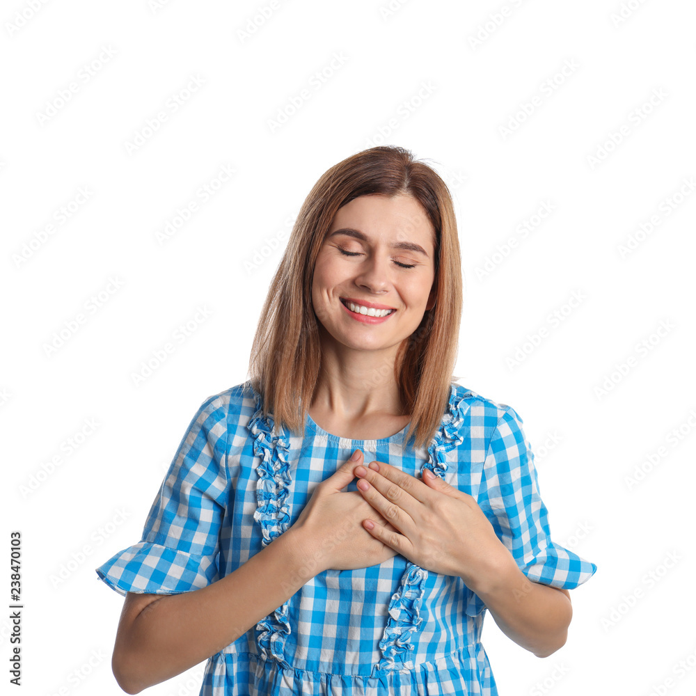 Woman holding hands near heart on white background Woman holding hands near heart on white background