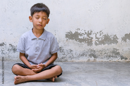 Asian Child Is Meditate.