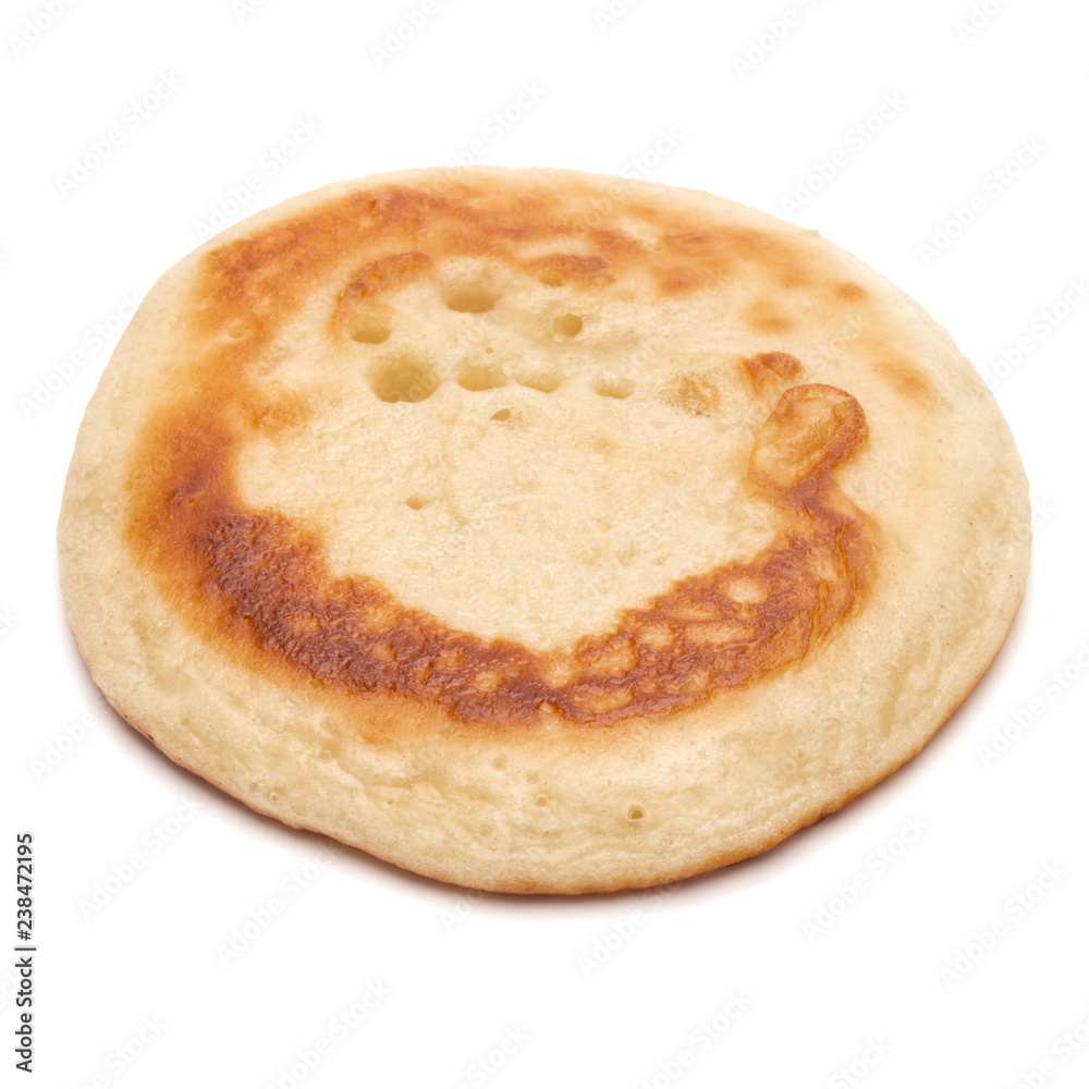 One pancake isolated on white background cutout. One pancake isolated on white background cutout.
