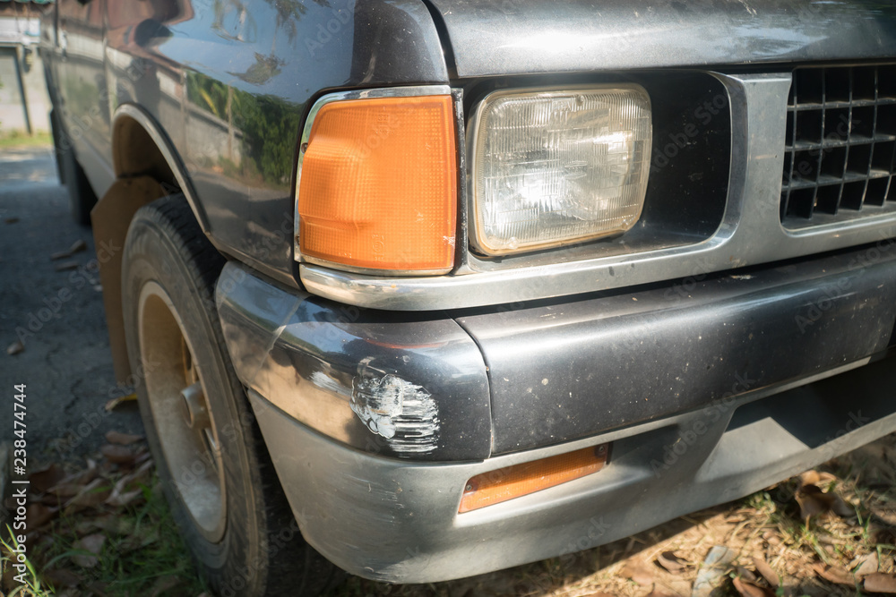 black car Surface of the car has scratches from the crash , scratches