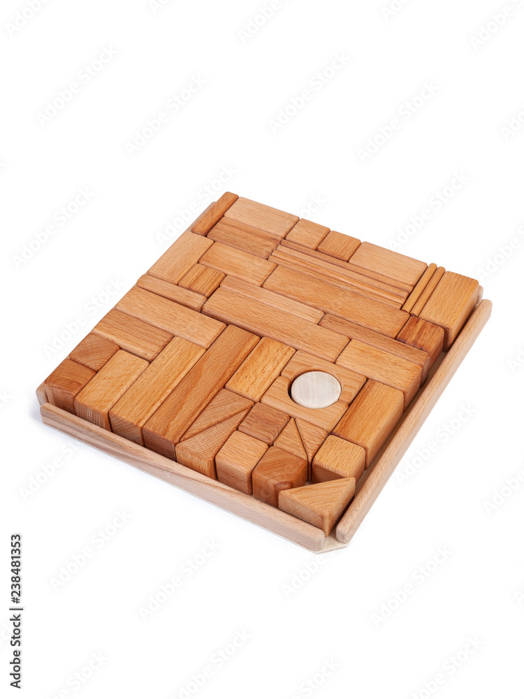 Photo wooden constructor of small cubes, triangles, balls and other forms of beech on a white isolated background Photo wooden constructor of small cubes, triangles, balls and other forms of beech on a white isolated background