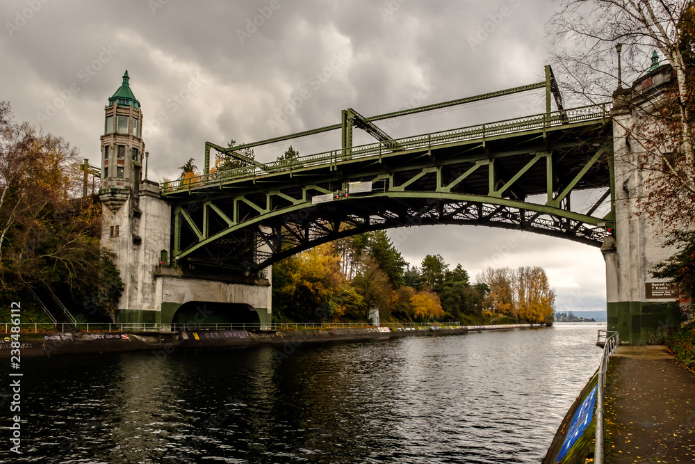 Montlake Bridge, Drawbridge on a dark and stormy day with fall trees in the background