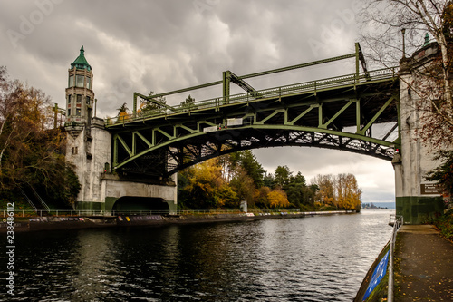 Montlake Bridge, Drawbridge on a dark and stormy day with fall trees in the background photo