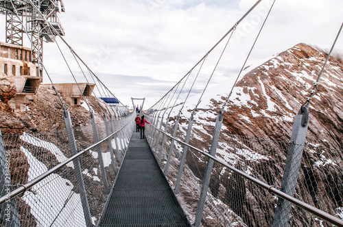 Cliff walk bridge mountain valley of Titlis in Engelberg, Switzerland photo