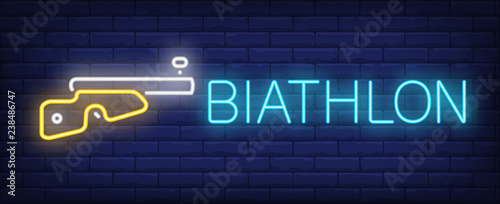 Biathlon neon sign. Glowing inscription with gun on brick wall background. Vector illustration can be used for sport, activity, Olympic games