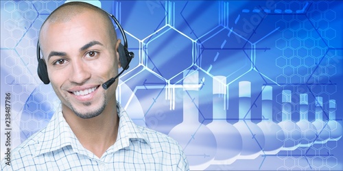 Smiling handsome businessman wearing headset looking at camera