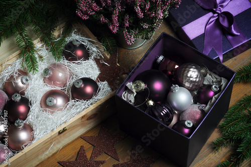 High angle view of colorful baubles with Christmas decorations on table at home photo