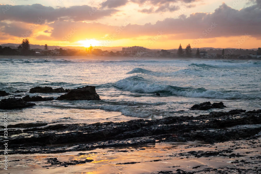Fototapeta premium Sunset Sunrise Ocean Long Exposure Currumbin beach Wave Rocks Background Orange Yellow Golden time