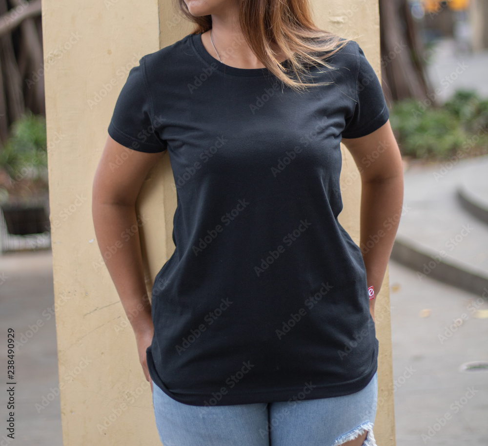 Female model wearing blank black t-shirt, ready for your mockup design ...