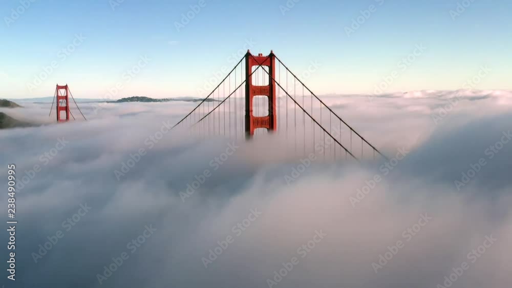 San Francisco Golden Gate Bridge Sticking / Poking Through Thick blanket of Fog - Aerial View / Flyover From Helicopter