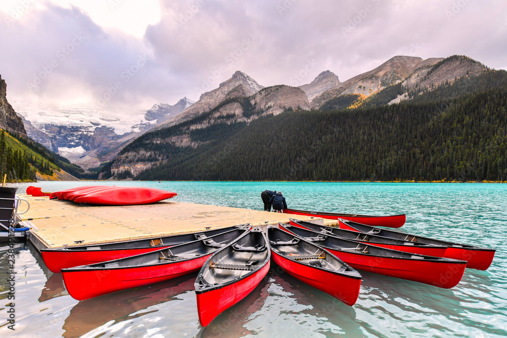 Canoeing at Lake Louise, one of the most beautiful alpine lakes in the Canadian Rockies, Banff