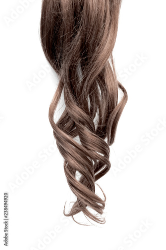 Natural wavy brown hair on white background