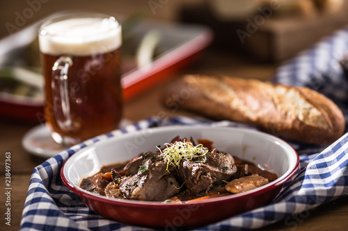Roast wild boar with carrot mushrooms, baguette and draft beer