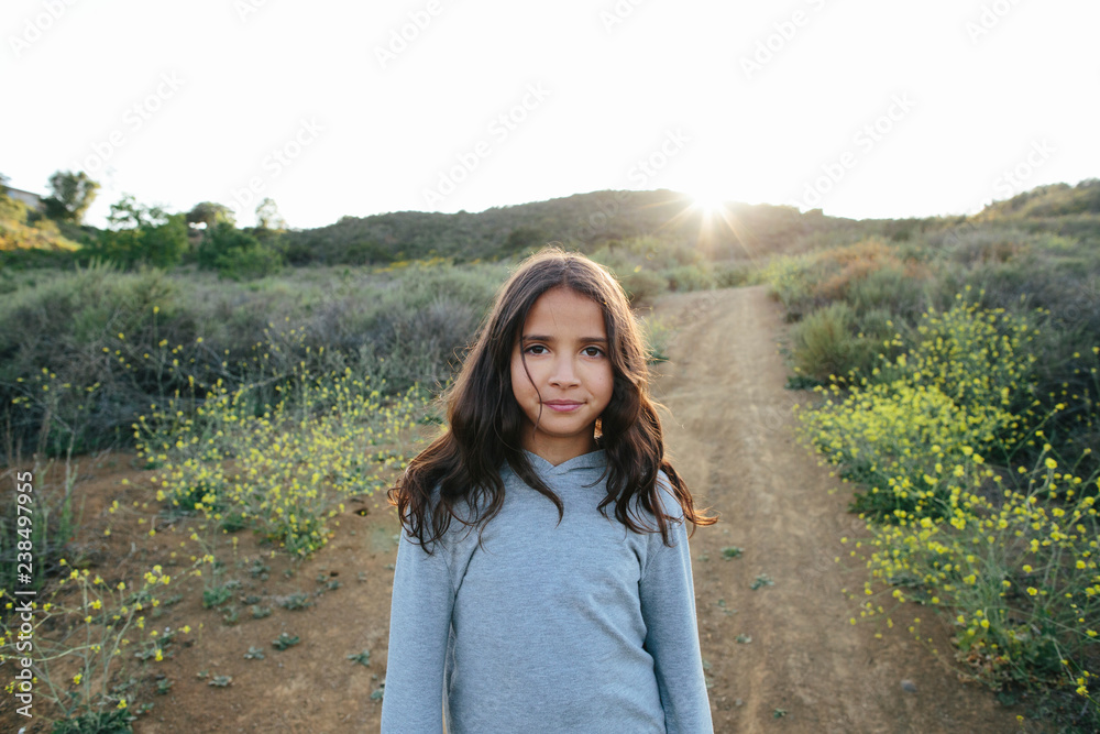 Portrait of girl standing on landscape against clear sky during sunset Portrait of girl standing on landscape against clear sky during sunset