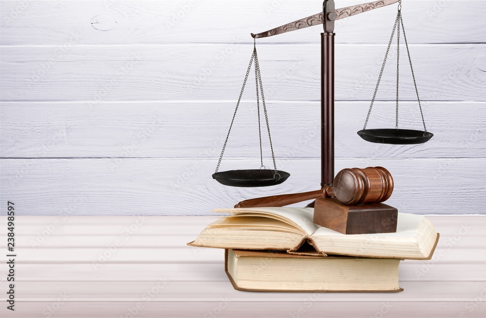 Books and wooden gavel on table. Justice concept Books and wooden gavel on table. Justice concept