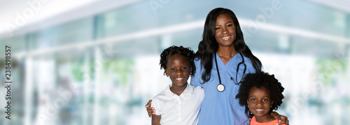 Nurse With Children At Hosp...