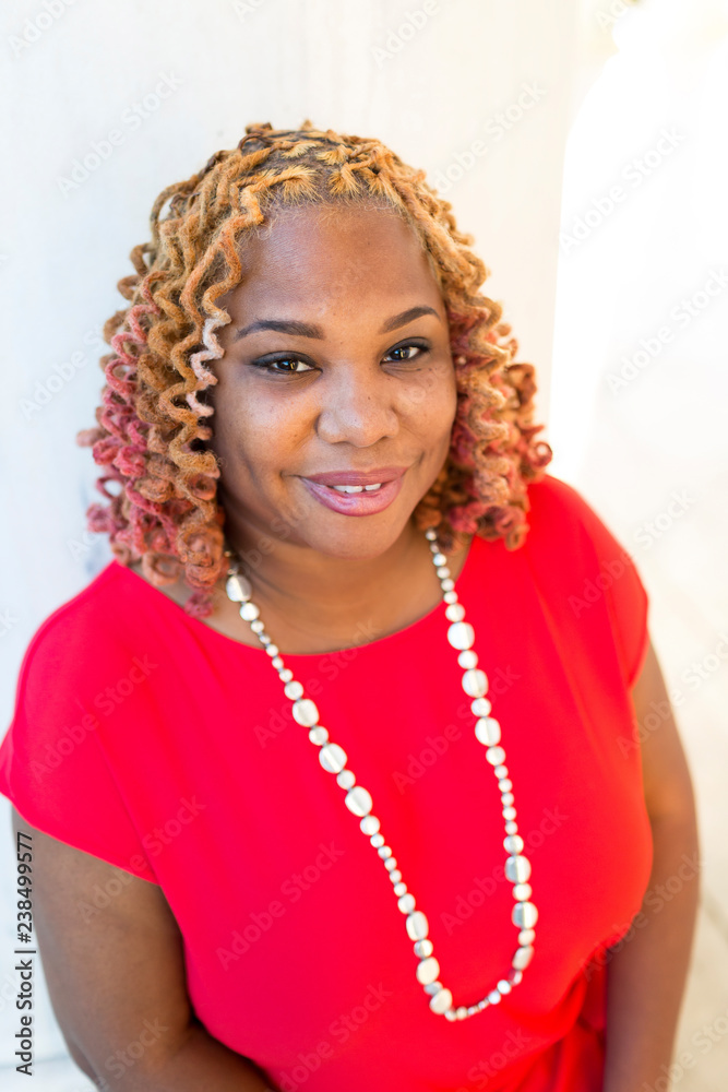 Portrait of smiling woman with curly hair Portrait of smiling woman with curly hair