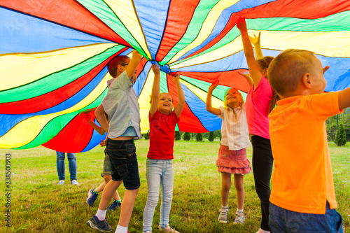 Fun and joy under colorful tent outdoors in the summer