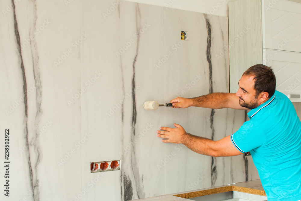 Young workman doing renovation at the home Young workman doing renovation at the home