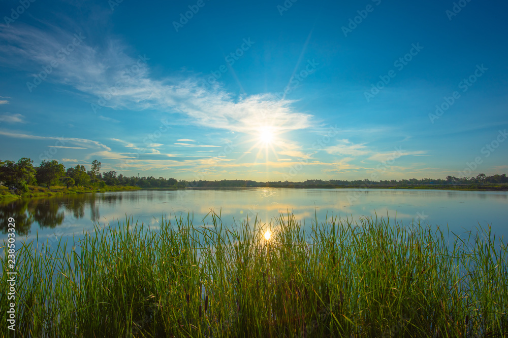 Sunset on lake in the summer , Evening sky Landscape Backgrounds Sunset on lake in the summer , Evening sky Landscape Backgrounds