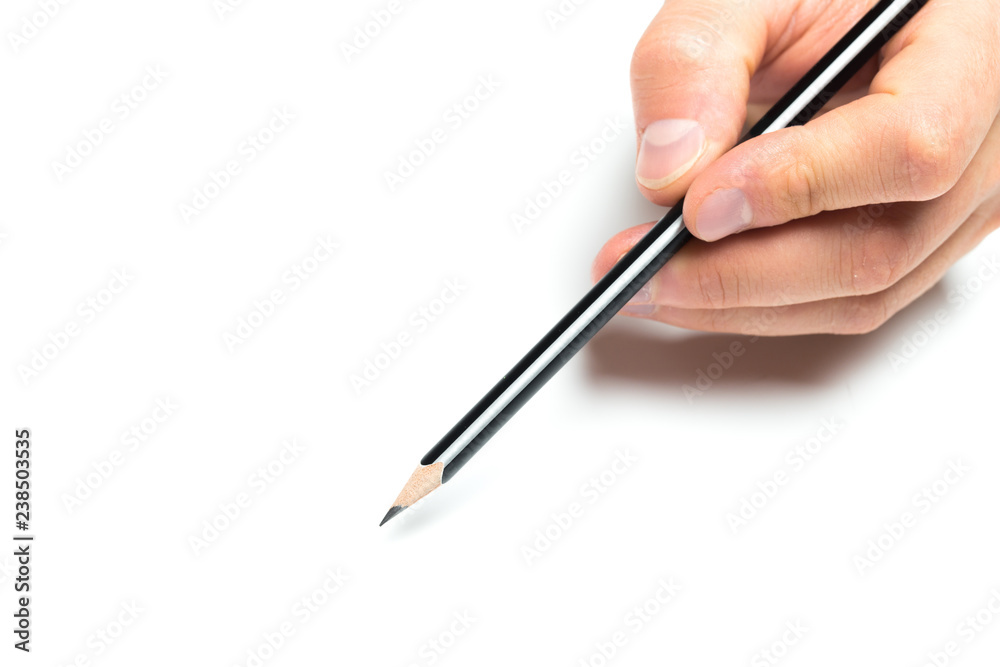 Men's hand holding wooden pencil on isolated backgroung, close up