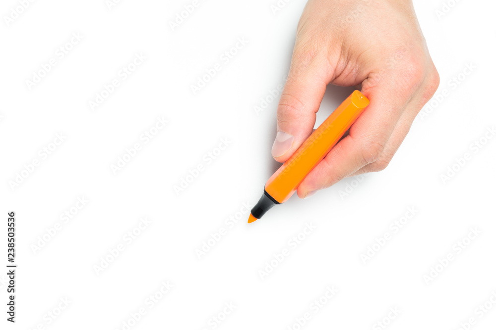Men's hand holding violet felt-tip pen on isolated backgroung, close up Men's hand holding violet felt-tip pen on isolated backgroung, close up