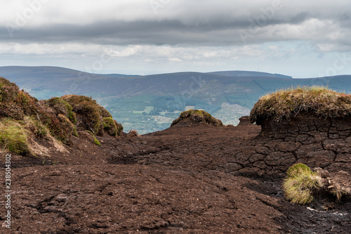 Irish blanket bog landscape on Tonduff Peak in Wicklow Mountains Ireland on an overcast day. photo