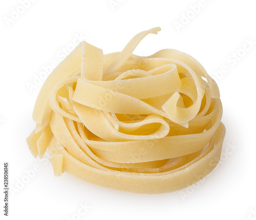 Uncooked nest of tagliatelle pasta isolated on white background with clipping path