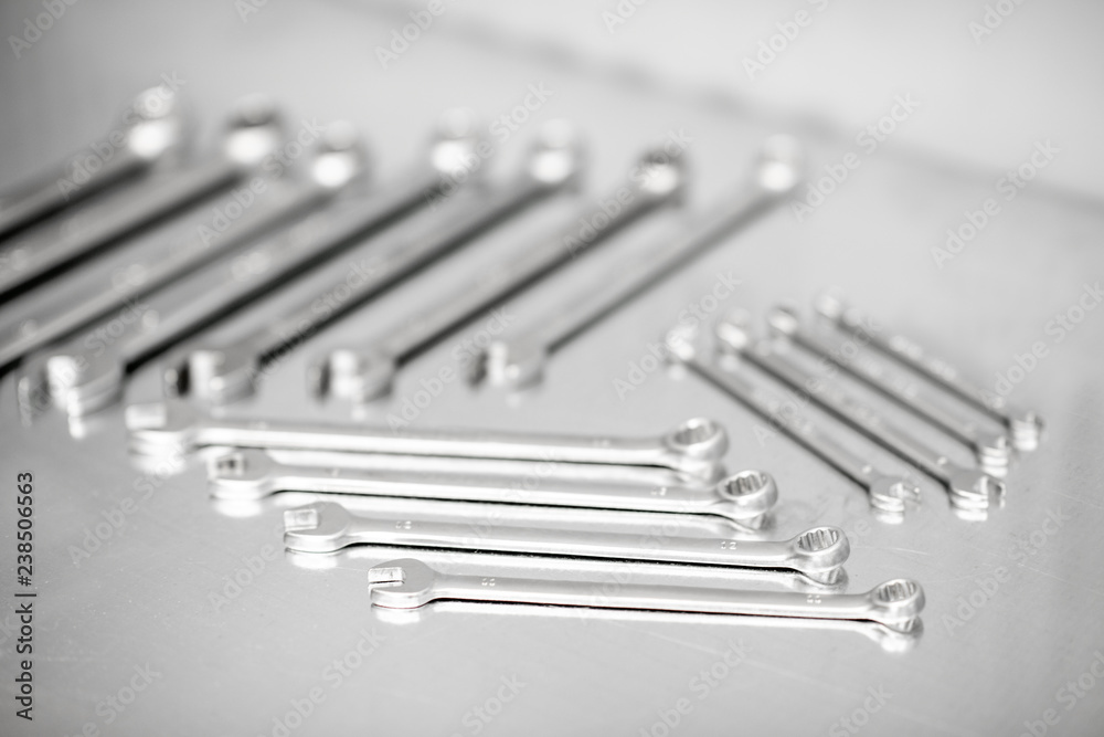 Pile of a new car wrenches on the stainless table Pile of a new car wrenches on the stainless table